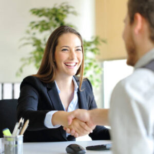 Businesspeople handshaking after deal or interview